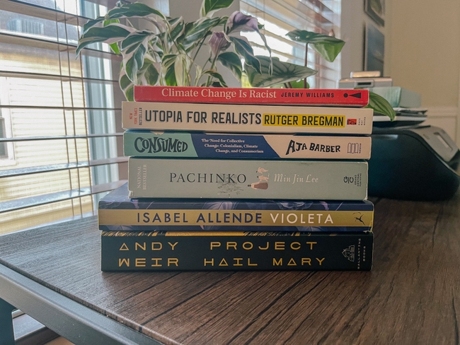 A stack of books which shows Indira's top 6 books of 2022
